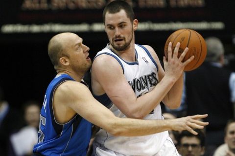 Minnesota Timberwolves forward Kevin Love drives against Dallas Mavericks forward Brian Cardinal (L) during the first half of their NBA basketball game in the Target Center in Minneapolis, March 7, 2011.       REUTERS/Eric Miller (UNITED STATES - Tags: SPORT BASKETBALL)