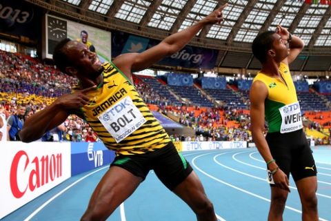 MOSCOW, RUSSIA - AUGUST 17:  Gold medalist Usain Bolt of Jamaica celebrates with silver medalist Warren Weir of Jamaica after the Men's 200 metres final during Day Eight of the 14th IAAF World Athletics Championships Moscow 2013 at Luzhniki Stadium on August 17, 2013 in Moscow, Russia.  (Photo by Cameron Spencer/Getty Images)