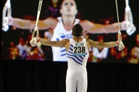 Greece's Eleftherios Petrounias competes on the rings for the Bronze medal, during the Gymnastics World Cup in Ghent, Belgium on Sunday, Sept. 12, 2010. (AP Photo/ Virginia Mayo)