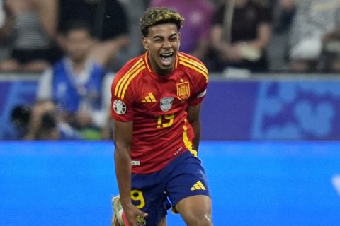 Spain's Lamine Yamal celebrates after scoring his side's first goal during a semifinal match between Spain and France at the Euro 2024 soccer tournament in Munich, Germany, Tuesday, July 9, 2024. (AP Photo/Matthias Schrader)