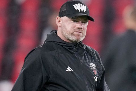 FILE - D.C. United head coach Wayne Rooney walks off the field after the team's MLS soccer match against Inter Miami, July 8, 2023, in Washington. Rooney is out as coach of D.C. United after one season, the team said. Despite the club falling short of the 2023 MLS Cup Playoffs, Rooney improved D.C. Uniteds point tally in his only full season at the helm. (AP Photo/Alex Brandon, File)