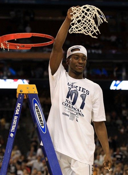 HOUSTON, TX - APRIL 04:  Kemba Walker #15 of the Connecticut Huskies cuts down the net after defeating the Butler Bulldogs to win the National Championship Game of the 2011 NCAA Division I Men's Basketball Tournament by a score of 53-41 at Reliant Stadium on April 4, 2011 in Houston, Texas.  (Photo by Streeter Lecka/Getty Images)