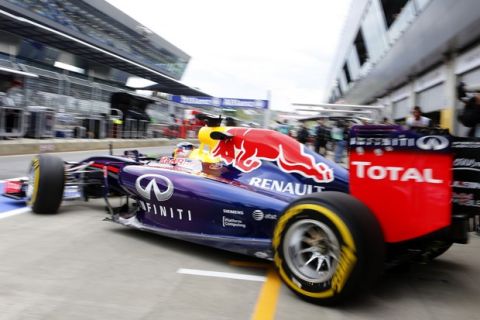 SPIELBERG, AUSTRIA - JUNE 20:  Sebastian Vettel of Germany and Infiniti Red Bull Racing exits the garage during practice ahead of the Austrian Formula One Grand Prix at Red Bull Ring on June 20, 2014 in Spielberg, Austria.  (Photo by Mathias Kniepeiss/Getty Images) *** Local Caption *** Sebastian Vettel