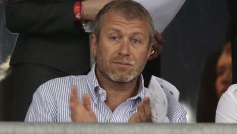 Chlelsea owner Roman Abramovich applauds  during the Euro 2012 soccer championship quarterfinal match between England and Italy in Kiev, Ukraine, Sunday, June 24, 2012. (AP Photo/Ivan Sekretarev) 