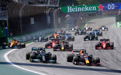 Mercedes' Veltteri Bottas, left, and Red Bull's Max Verstappen steer their cars at the start of the Brazilian Formula One Grand Prix at the Interlagos race track in Sao Paulo, Brazil, Sunday, Nov. 14, 2021. (AP Photo/Andre Penner)