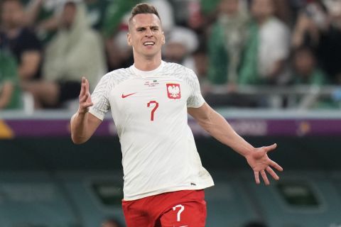 Poland's Arkadiusz Milik is in action during the World Cup group C soccer match between Poland and Saudi Arabia, at the Education City Stadium in Al Rayyan, Qatar, Saturday, Nov. 26, 2022. (AP Photo/Aijaz Rahi)