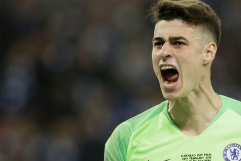 Chelsea goalkeeper Kepa Arrizabalaga reacts after stops a shot from Manchester City's Leroy Sane during a penalty shootout at the end of the English League Cup final soccer match between Chelsea and Manchester City at Wembley stadium in London, England, Sunday, Feb. 24, 2019. (AP Photo/Tim Ireland)