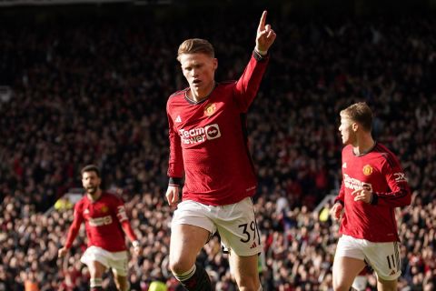 Manchester United's Scott McTominay, canter, celebrates after scoring his side's opening goal during the FA Cup quarterfinal soccer match between Manchester United and Liverpool at the Old Trafford stadium in Manchester, England, Sunday, March 17, 2024. (AP Photo/Dave Thompson)