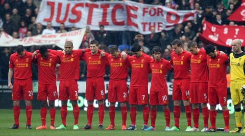 Liverpool players stand for a inutes silence for the Hillsborough victims during Reading v Liverpool, Barclays Premier League, Madejski Stadium, Reading, Sat 13th April 2013.