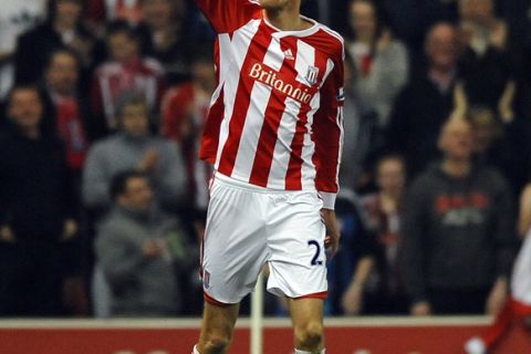 Stoke City's English striker Peter Crouch celebrates scoring the opening goal of the English Premier League football match between Stoke City and Manchester City at The Britannia stadium, Stoke-on-Trent, England, on March 24, 2012. AFP PHOTO/PAUL ELLIS

RESTRICTED TO EDITORIAL USE. No use with unauthorized audio, video, data, fixture lists, club/league logos or live services. Online in-match use limited to 45 images, no video emulation. No use in betting, games or single club/league/player publications. (Photo credit should read PAUL ELLIS/AFP/Getty Images)