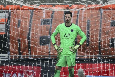 PSG's goalkeeper Sergio Rico, center, reacts after being defeated by FC Lorient during the French League One soccer match between FC Lorient and Paris Saint-Germain at the Moustoir stadium in Lorient, western France, Sunday, Jan. 31, 2021. (AP Photo/David Vincent)