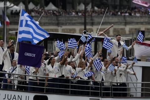 Team Greece-s boat parades along the Seine river in Paris, France, during the opening ceremony of the 2024 Summer Olympics, Friday, July 26, 2024. (AP Photo/Luca Bruno)