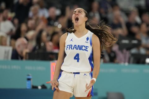 Marine Fauthoux (4), of France, reacts during a women's gold medal basketball game at Bercy Arena at the 2024 Summer Olympics, Sunday, Aug. 11, 2024, in Paris, France. (AP Photo/Michael Conroy)