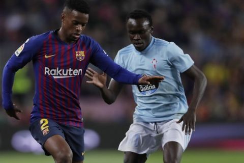 FC Barcelona's Semedo, left, duels for the ball with Celta Vigo's Pione Sisto during the Spanish La Liga soccer match between FC Barcelona and Celta Vigo at the Camp Nou stadium in Barcelona, Spain, Saturday, Dec. 22, 2018. (AP Photo/Manu Fernandez)