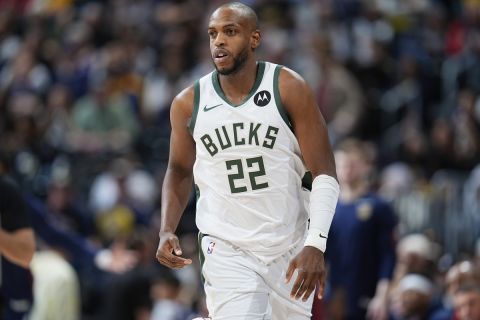 Milwaukee Bucks forward Khris Middleton (22) in the second half of an NBA basketball game Monday, Jan. 29, 2024, in Denver. (AP Photo/David Zalubowski)