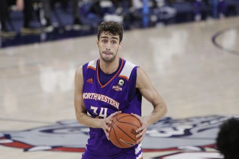 Northwestern State forward Robert Chougkaz prepares to pass the ball during the first half of an NCAA college basketball game against Gonzaga in Spokane, Wash., Monday, Dec. 21, 2020. (AP Photo/Young Kwak)