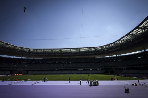 People pack hurdles after a rehearsal at the Stade de France stadium, Tuesday, June 25, 2024 in Saint-Denis, outside Paris. The Stade de France will host the athletics competitions during the Paris 2024 Olympic Games. (AP Photo/Thomas Padilla)