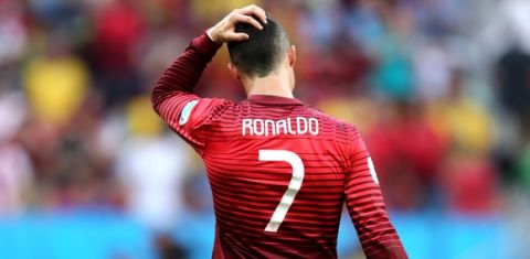 BRASILIA, BRAZIL - JUNE 26:  Cristiano Ronaldo of Portugal reacts after the 2014 FIFA World Cup Brazil Group G match between Portugal and Ghana at Estadio Nacional on June 26, 2014 in Brasilia, Brazil.  (Photo by Warren Little/Getty Images)