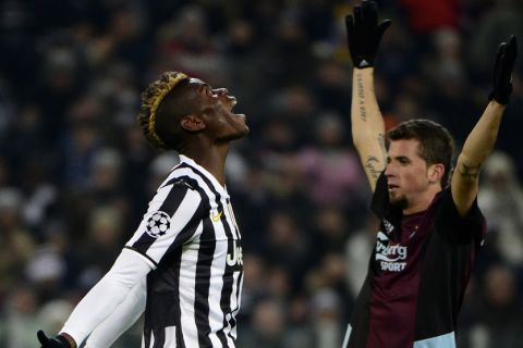 Juventus' French midfielder Paul Labile Pogba (L) reacts after missing a shot during the UEFA Champions League group B football match Juventus vs Copenhagen, on November 26, 2013 at the Juventus stadium in Turin. AFP PHOTO / OLIVIER MORIN        (Photo credit should read OLIVIER MORIN/AFP/Getty Images)