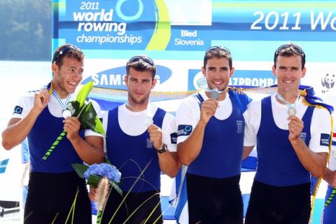 BLED, SLOVENIA - SEPTEMBER 04:  Stergios Papachristos, Ioannis Tsilis, Georgios Tziallas, Ioannis Christou of Greece pose with their silver medals after the Men's Four final during day eight of the FISA Rowing World Championships at Lake Bled on September 4, 2011 in Bled, Slovenia.  (Photo by Richard Heathcote/Getty Images)