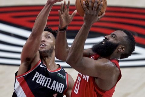 Houston Rockets guard James Harden, right, shoots over Portland Trail Blazers guard Evan Turner during the first half of an NBA basketball game in Portland, Ore., Saturday, Jan. 5, 2019. (AP Photo/Craig Mitchelldyer)