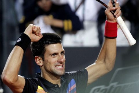 Novak Djokovic of Serbia celebrates after winning against Robin Soderling of Sweden during their quarter-final match at the Rome Masters tennis tournament May 13, 2011. REUTERS/Alessia Pierdomenico (ITALY - Tags: SPORT TENNIS)