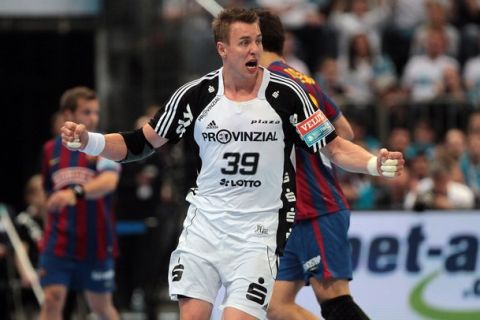 COLOGNE, GERMANY - MAY 30: Filip Jicha of Kiel celebrates a goal during the handball final match between THW Kiel and FC Barcelona Borges at the Lanxess Arena on May 30 in Cologne, Germany. (Photo by Christof Koepsel/Bongarts/Getty Images)