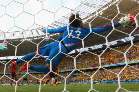 FORTALEZA, BRAZIL - JUNE 17: Guillermo Ochoa of Mexico dives to make a save during the 2014 FIFA World Cup Brazil Group A match between Brazil and Mexico at Castelao on June 17, 2014 in Fortaleza, Brazil.  (Photo by Robert Cianflone/Getty Images)