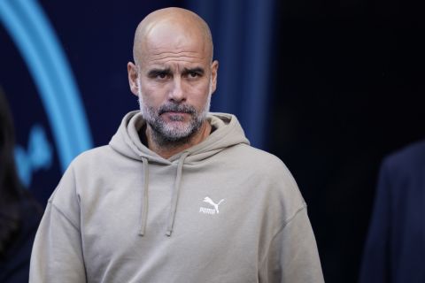 Manchester City's head coach Pep Guardiola enters to the pitch prior to the English Premier League soccer match between Manchester City and Ipswich Town at the Etihad Stadium in Manchester, England, Saturday, Aug. 24, 2024. (AP Photo/Dave Thompson)