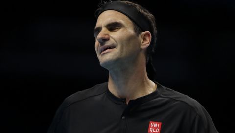 Roger Federer of Switzerland reacts after losing a point against Stefanos Tsitsipas of Greece during their ATP World Tour Finals semifinal tennis match at the O2 Arena in London, Saturday, Nov. 16, 2019. (AP Photo/Kirsty Wigglesworth)