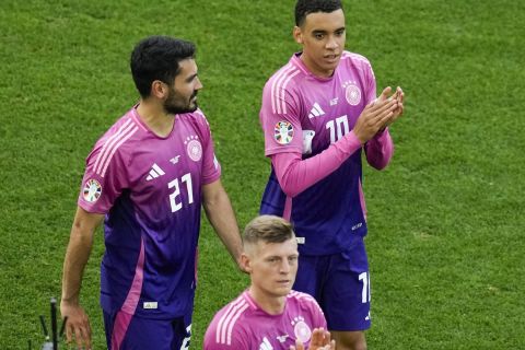 Germany's Ilkay Gundogan (21) and Jamal Musiala (10) react after a 2-0 win over Hungary in a Group A match at the Euro 2024 soccer tournament in Stuttgart, Germany, Wednesday, June 19, 2024. (AP Photo/Themba Hadebe)