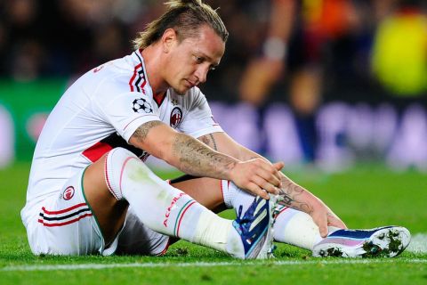 BARCELONA, SPAIN - MARCH 12:  Philippe Mexes of AC Milan looks dejected at the end of the UEFA Champions League round of 16 second leg match between FC Barcelona and AC Milan at the Camp Nou Stadium on March 12, 2013 in Barcelona, Spain. FC Barcelona won 4-0.  (Photo by David Ramos/Getty Images)