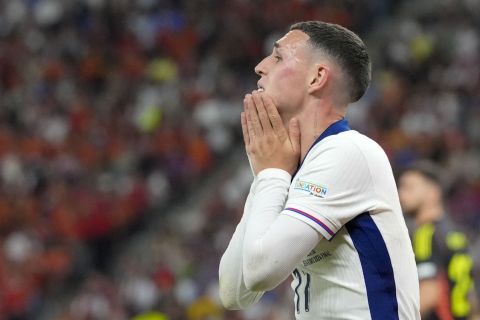 England's Phil Foden reacts after missing a chance to score during the final match between Spain and England at the Euro 2024 soccer tournament in Berlin, Germany, Sunday, July 14, 2024. (AP Photo/Martin Meissner)