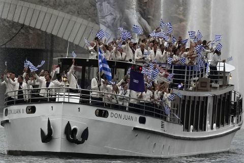 Team Greece's boat parades along the Seine river in Paris, France, during the opening ceremony of the 2024 Summer Olympics, Friday, July 26, 2024. (AP Photo/Luca Bruno)