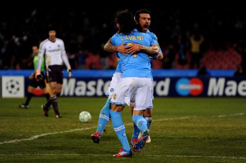 NAPLES, ITALY - FEBRUARY 21:  Ezequiel Lavezzi of Napoli celebrates with teammate Edinson Cavani #6 after scoring his team's third goal during the UEFA Champions League round of 16 first leg match between SSC Napoli and Chelsea FC at Stadio San Paolo on February 21, 2012 in Naples, Italy.  (Photo by Mike Hewitt/Getty Images)