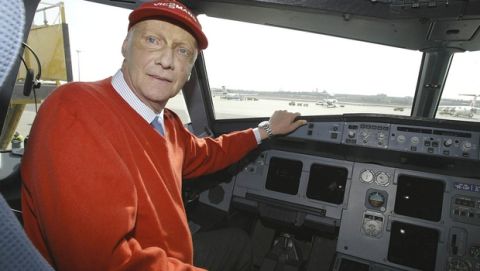 Former Formula One champion Niki Lauda, chief  of the new Austrian discount airline Niki poses in the cockpit of one of his new planes during a press conference at Vienna's airport in Schwechat on Tuesday, March 16, 2004. (AP Photo/Hans Punz)