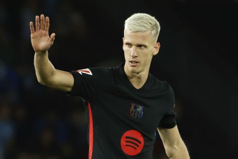 Barcelona's Dani Olmo gestures during the Spanish La Liga soccer match between Celta Vigo and Barcelona at the Balaidos stadium in Vigo, Spain, Saturday, Nov. 23, 2024. (AP Photo/Lalo R. Villar)