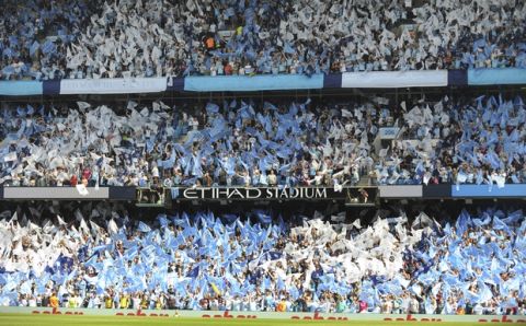 Manchester City fans cheer prior to the English Premier League soccer match between Manchester City and Huddersfield Town at Etihad stadium in Manchester, England, Sunday, May 6, 2018. (AP Photo/Rui Vieira)