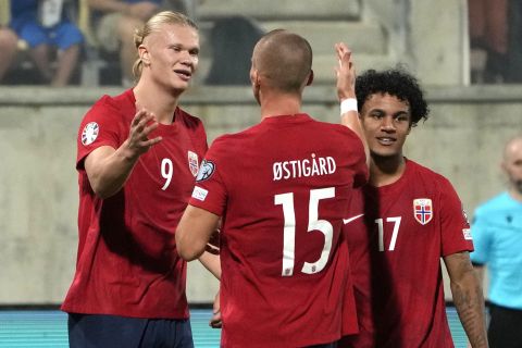 Norway's Erling Haaland, left, celebrates after scoring his side's 2nd goal during the Euro 2024 group A qualifying soccer match between Cyprus and Norway at the AEK arena stadium in Larnaca, Cyprus, Thursday, Oct. 12, 2023. (AP Photo/Petros Karadjias)