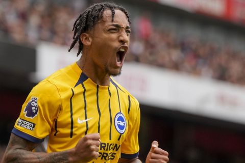 Brighton's Joao Pedro celebrates after scoring his side's opening goal during the English Premier League soccer match between Arsenal and Brighton, at Emirates Stadium in London, Saturday, Aug. 31, 2024. (AP Photo/Alastair Grant)