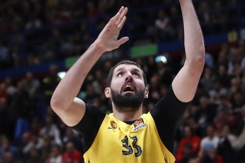 Barcelona's Nikola Mirotic scores a basket during the Euro League basketball match between Olimpia Milan and FC Barcelona Lassa, in Milan, Italy, Friday, Nov. 1, 2019. (AP Photo/Antonio Calanni)