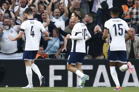 England's Declan Rice, left, celebrates after scoring the opening goal of the game during the UEFA Nation's League soccer match between Ireland and England at the Aviva stadium in Dublin, Ireland, Saturday, Sept. 7, 2024. (AP Photo/Peter Morrison)