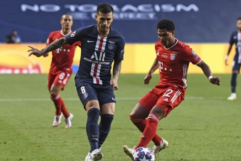 PSG's Leandro Paredes and Bayern's Serge Gnabry, right, challenge for the ball during the Champions League final soccer match between Paris Saint-Germain and Bayern Munich at the Luz stadium in Lisbon, Portugal, Sunday, Aug. 23, 2020. (David Ramos/Pool via AP)