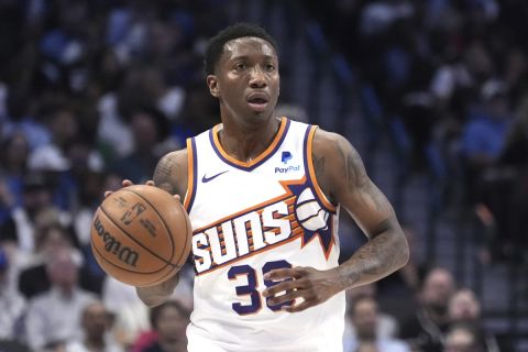 Phoenix Suns guard Saben Lee handles the ball during an NBA basketball game against the Dallas Mavericks in Dallas, Thursday, Feb. 22, 2024. (AP Photo/Tony Gutierrez)