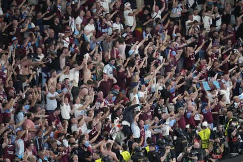 West Ham fans celebrate after the Europa Conference League final soccer match between Fiorentina and West Ham at the Eden Arena in Prague, Wednesday, June 7, 2023. (AP Photo/Darko Vojinovic)