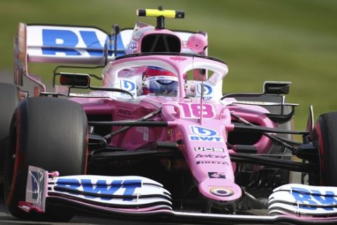 Racing Point driver Lance Stroll of Canada steers his car during the second practice session for the British Formula One Grand Prix at the Silverstone circuit in Silverstone, England, Friday, July 31, 2020. The British Formula One Grand Prix race will be held on Sunday. (Bryn Lennon/Pool via AP)