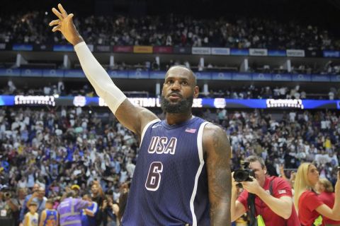 United States' forward LeBron James waves to the crowd after the end of an exhibition basketball game between the United States and South Sudan, at the o2 Arena in London, Saturday, July 20, 2024. (AP Photo/Kin Cheung)