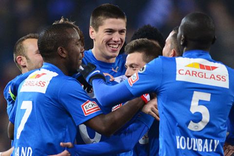 20130217 - GENK, BELGIUM: Genk's Jeroen Simaeys (C L), Genk's Benjamin Benji De Ceulaer (C) and their teammates celebrate after Simaeys scored the 1-0 goal during the Jupiler Pro League match between RC Genk and KV Kortrijk, in Genk, Sunday 17 February 2013, on day 27 of the Belgian soccer championship. BELGA PHOTO YORICK JANSENS