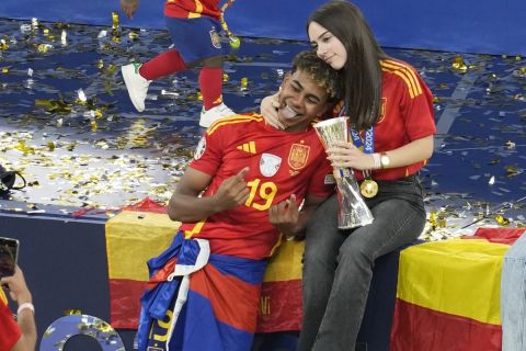 Spain's Lamine Yamal poses for a photo at the end of the final match against England at the Euro 2024 soccer tournament in Berlin, Germany, Sunday, July 14, 2024. Spain won the game 2-1. (AP Photo/Thanassis Stavrakis)