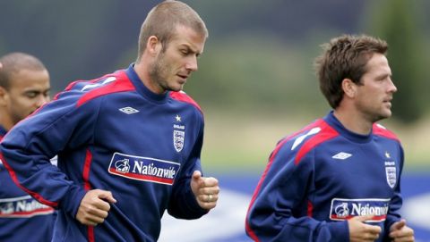 England soccer players David Beckham, left, and Michael Owen during an England team training session at London Colney, London, Monday Aug. 20, 2007. Engalnd are to play Germany in a friendly soccer match at Wembley Stadium on Wednesday Aug. 22. (AP Photo/Kirsty Wigglesworth)